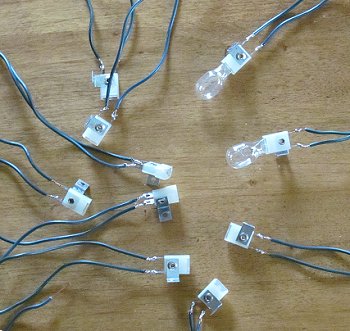 Wedge sockets with wire leads soldered on. Click for bigger photo.