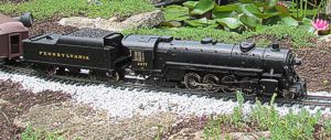 My Aristo Mikado on a test run near the pond.  This is a very solid locomotive, quite well-engineered and heavy.  Click for a bigger photo.