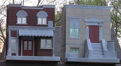 Garden Railroad Townhouse and Storefront, made from Playskool Sesame Street set. Click for bigger photo.