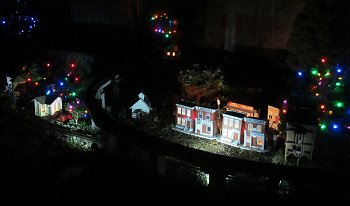 Paul and Shelia's garden railroad, the New Boston and Donnels Creek, after dark, Nov., 2014.  Click to see a bigger photo.