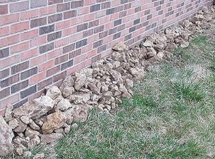 Most of the rocks I collected after the initial leveling and scraping.  The landscaper offered to get rid of them for me, but I plan to use most of them in our gardens and garden railroad. Click for bigger photo.