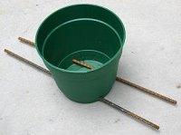 Sleeve pot with rebar to hold it in the ground. Click for bigger photo.