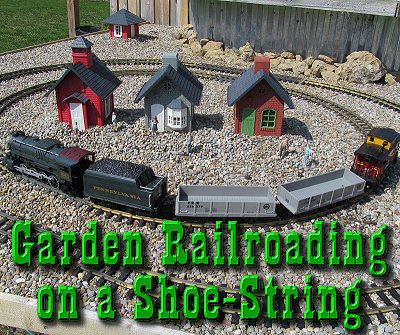 Garden Railroading on a Shoe String.  Though this setup is actually on an unfinished part of Paul's larger railroad, it shows that a Lionel battery-powered train, cheap Chinese-made figures, and North States bird feeders can create a fun outdoor railroad for a limited cost.  Click for bigger photo.