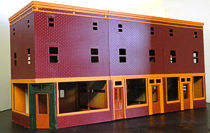 Colorado Model Structures offers this row of storefronts as a single, inexpensive kit.  Click for bigger photo.