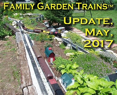 May, 2017 Update from Family Garden Trains<sup><small>TM</small></sup>.  This is a photo that my friend Wil Davis took of our first garden railroad in 2003, during a national convention in Cincinnati.  Most of what you can see was built in late 2002, destroyed by falling trees in March, 2003 and rebuilt by June.  But I was younger then.  Within 12 years after this photo, the railroad ties had almost all disintegrated, and the weeds had gotten so bad that I had to dig up the ROW in the foreground to pour concrete under it, so I learned a lot about maintenance and 'what not to do' with this railroad.  Click to see Wil's original photo.