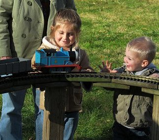 A youngster playing with the vintage PlaySkool train set, Christmas Train Day, 2013.  Click for a bigger photo.