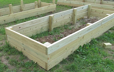 The first raised bed with the posts cut and the third layer of boards installed. Click for bigger photo.