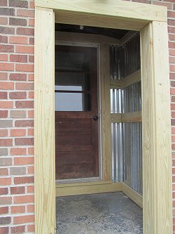 The reworked back entrance to our home, using corrugated steel.  View from the outside. Click for bigger photo.