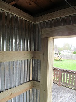 The reworked back entrance to our home, using corrugated steel.  View from the inside. Click for bigger photo.