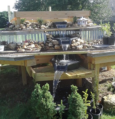 Testing the flow of the waterfall with the utility tub and the second Maccourt pond. Click for bigger photo.