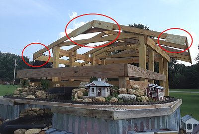 I temporarily added pices of 5/4x6in boards to the end pieces so I could be certain I had the sheathing aligned properly. Click for bigger photo.