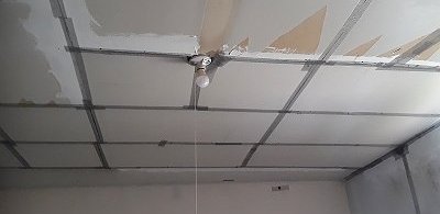 The ceiling with drywall installed and the edges taped. Click for bigger photo.