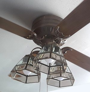 A used ceiling fan, repainted and equipped with a vintage-style light fixture from our old house.  Click for bigger photo.