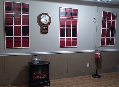 The south wall of our detatched garage, which the previous owner left looking like a bomb went off.  Click for bigger photo.