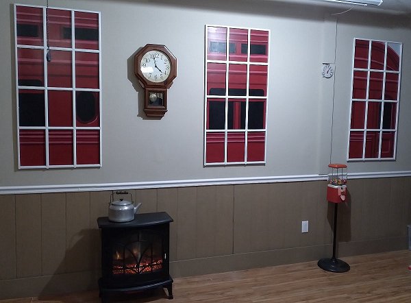 The three windowframes tacked into place on the garage wall, along with a repro Regulator clock. Click for bigger photo.