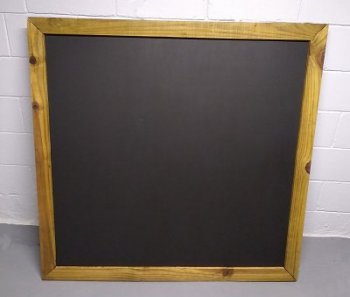 The chalkboard is framed with fence boards that were spit, cut to size, and stained.  Click for bigger photo.
