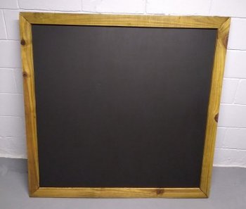 The chalkboard is framed with fence boards that were spit, cut to size, and stained.  Click for bigger photo.