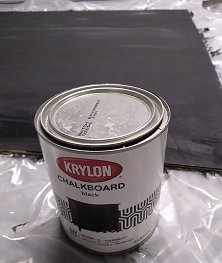 Krylon chalkboard paint was used to create a flat chalkboard-like surface for the train times and destinations portion of the timetable.  Click for bigger picture.