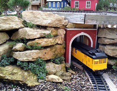 The northeast tunnel portal with an HLW railbus poking out.  Click for bigger photo.