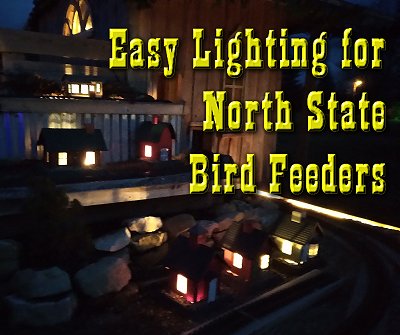 A cluster of North States bird feeders lit by 12-volt outoor lighting circuits. Click for bigger photo.