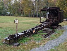 This log loader represents an entire family of cranes, winches, and 'skidders' that were used to retrieve huge logs from valleys and mountainsides and get them safely onto the log cars.  Click for bigger photo.