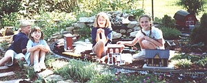 Click to see article about kids setting up and running my garden railroad in Y2K.