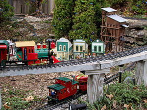 The Lionel 0-6-0 on the overpass near Fort Tecumseh. The Santa conductor in the caboose on the lower track was scrounged from an airplane ornament twenty years ago and repainted.  Click for a bigger photo.