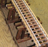 This photo shows what the trestle bents and stringers looked like after the stain was sprayed on.  Click for bigger photo.