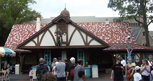 The older buildings in Fantasyland tend to look German, as did the cottages in movies such as Snow White.  The varigated roof color is a hint that you shouldn't take this building too seriously. Click for bigger photo.