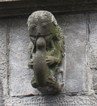 I know this looks like a monkey devouring a lizard, but it's supposed to represent a monkey carrying a baby.  Really.  Click to see the rest of this carving.