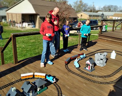 A family running three Ready-To-Play trains at the same time in close proximity.  Thomas, Hogwarts Express, and a Frozen-themed train.  Click for bigger photo.