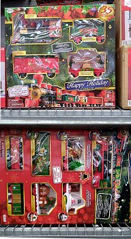 Two EZ-Tech train sets offered in WalMart in 2022.  The small set is called 'Happy Holiday Express' and includes 2-6-0 loco, tender, elf handcar, and a boxcar. I'm thinking it was around $60.  The large set is called 'Santa Epress' and includes 4-4-2 loco, tender, teddy bear car, windmill car, snowman snowglobe car and green boxcar.  I'm thinking it was around $100.