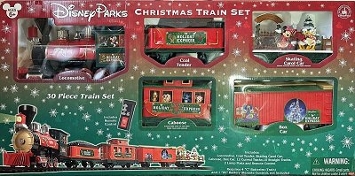 The 'Disney Parks Christmas Train Set' in a freight train version. This is a modern train with remote control and the batteries in the locomotive. It is hard to find and seems to be in high demand because of the skating car.  Click for bigger photo.