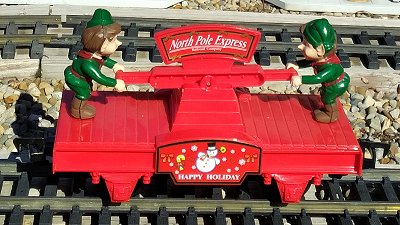 The elf handcar includes two elves pumping as though the train's forward motion depended on their contribution.  It is by far the most common animated car in the series. Click for bigger photo.