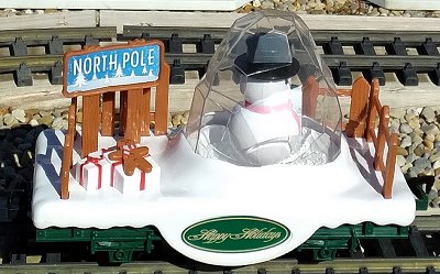 The snow globe car includes a snowman who spins around and tiny styrofoam balls that bounce up to simulate snow. Click for bigger photo.