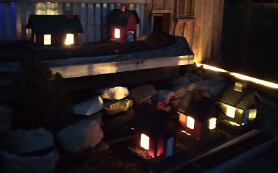 Some of my North States bird feeders set up and lit for winter display.  Click for bigger photo.